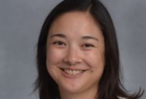 Close up of smiling Asian-American woman.