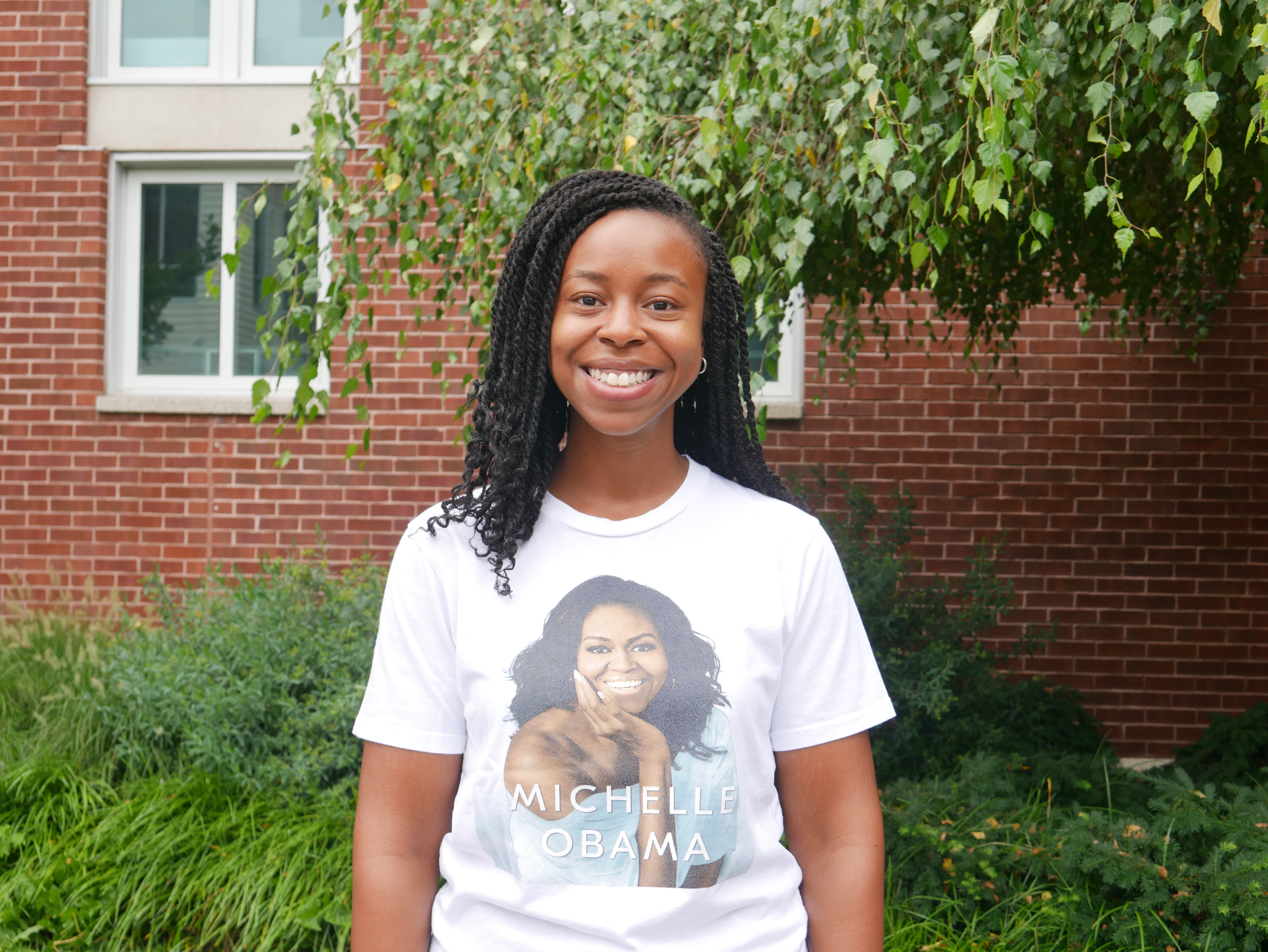 Woman smiling outside on campus