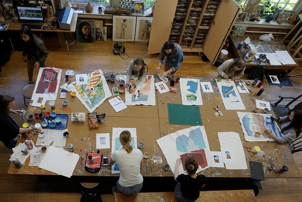 Student artists work in the Wheeler Studio on art pieces for a new mural.