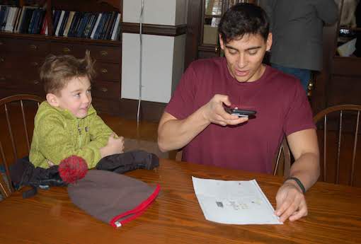 Founder of the Speechify app Cliff Weitzman shows a young student how it can convert text to speech.