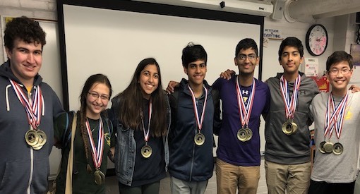 High school students wearing medals after winning the state Envirothon.