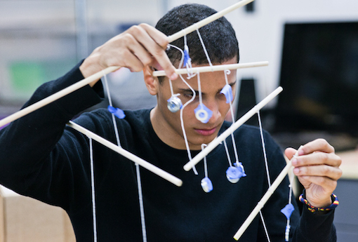 A boy works on an engineering design.