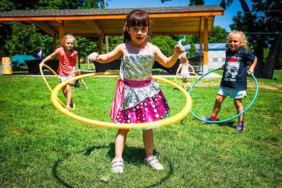 Girls play with hula hoops at Wheeler Summer Camp
