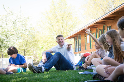 Hamilton teacher calls on eager students outdoors at the Farm.