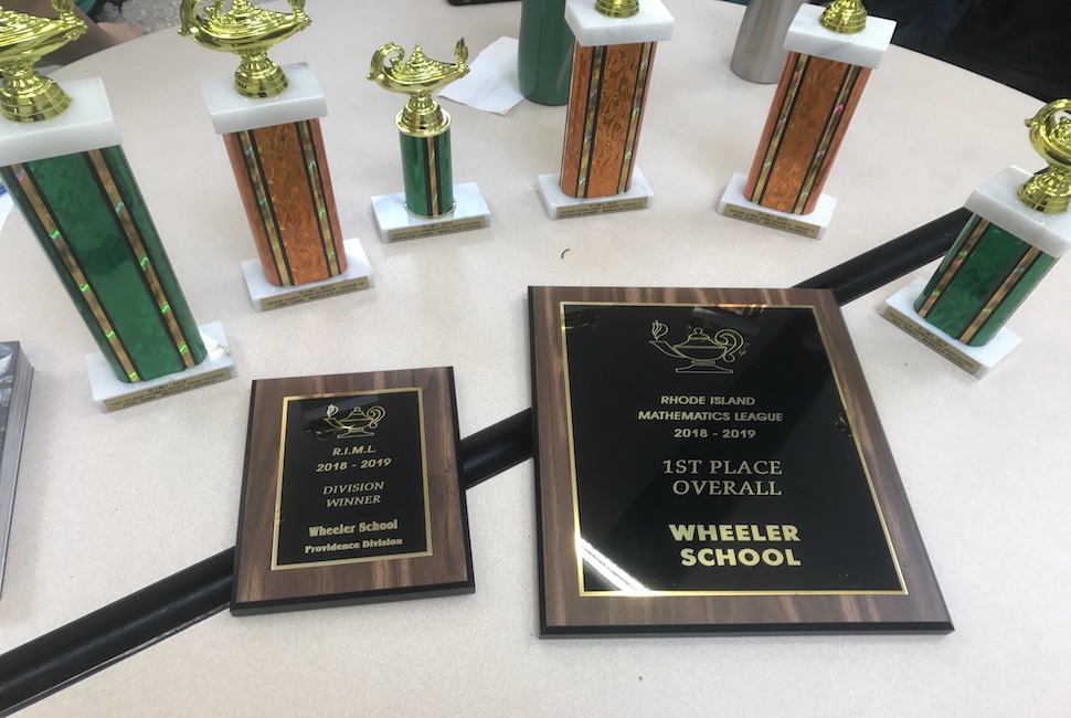 Trophies and plaques for first place math competition wins