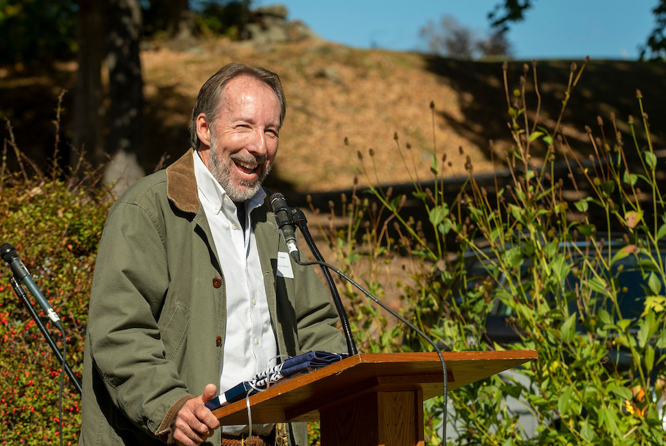 Science faculty member Bob Schmidt at the podium accepting an honor from The Harvey School (NY).
