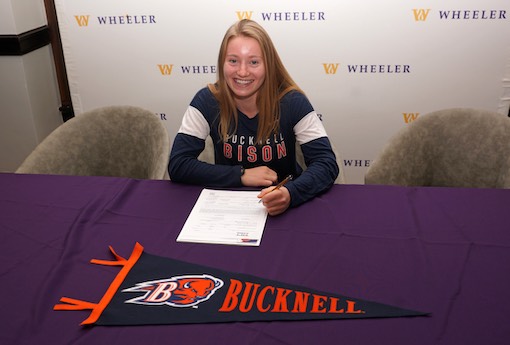 student athlete signing national letter of intent for college