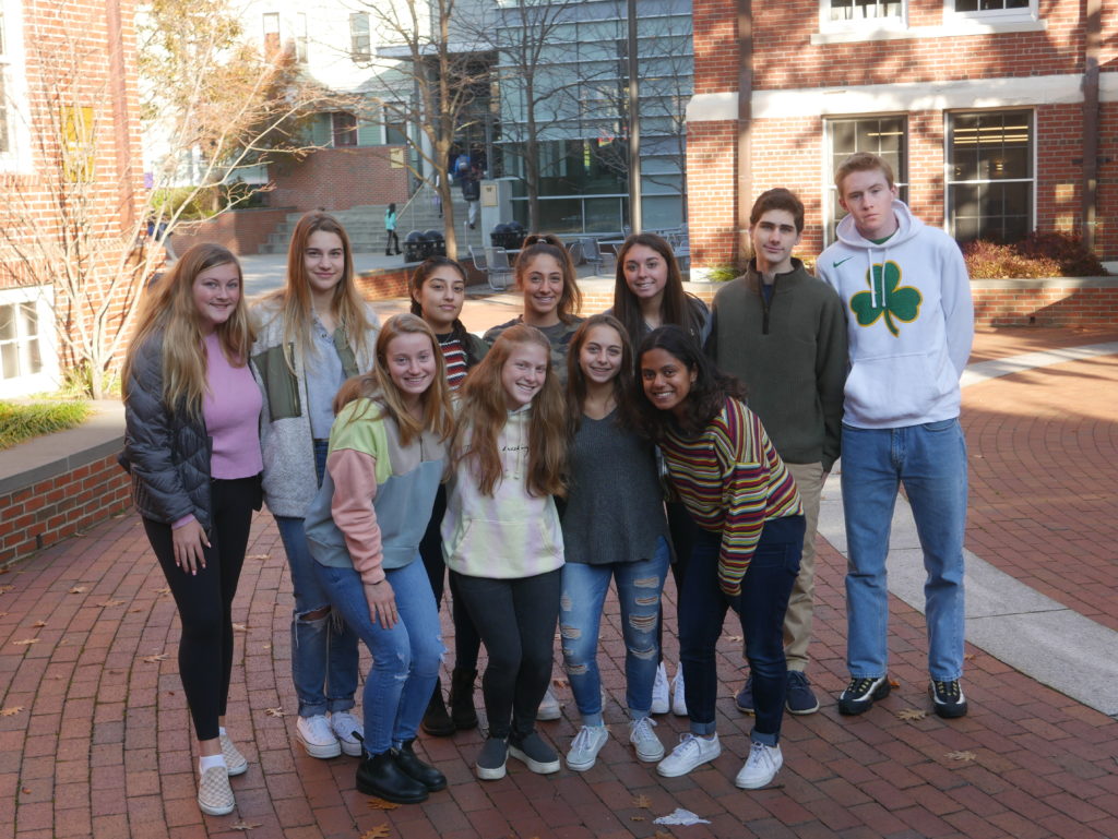 Group of high school students gathered in the Creamer Courtyard at Wheeler.