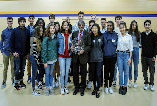 Students gather around Dr. Arun Singh after he is presented with the Wheeler Community Spirit Award