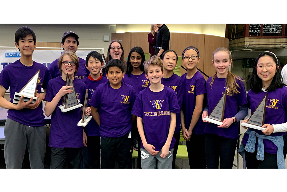 Students holding trophies, wearing Wheeler tshirts at Mathcounts 2020