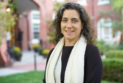 Head of School stands before the iconic Hope Building portico