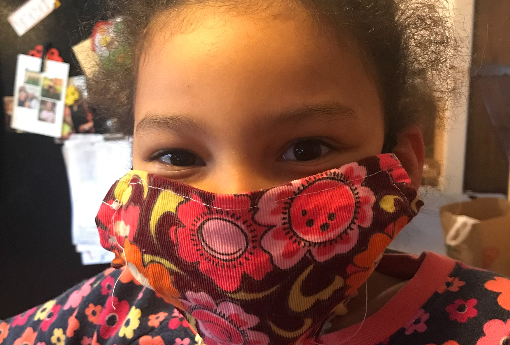 Kindergarten student wearing a homemade virus mask.