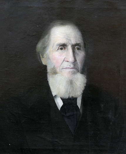 Portrait of an elderly man with a beard.