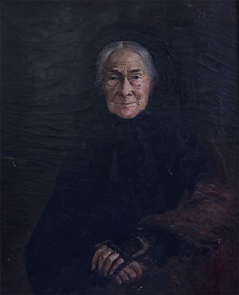 Portrait of an elderly woman in black clothing.