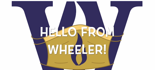 Wheeler W in a safety mask with Hello From Wheeler written across slide.