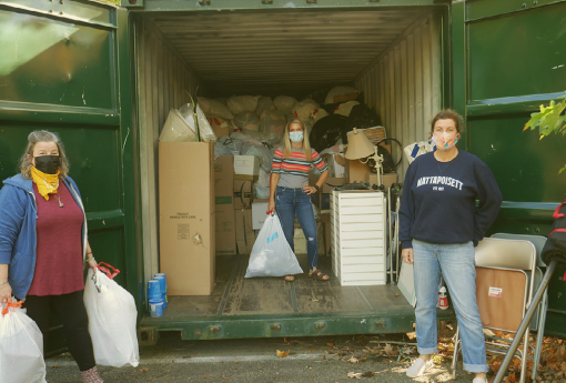 women holding clothing donation bags