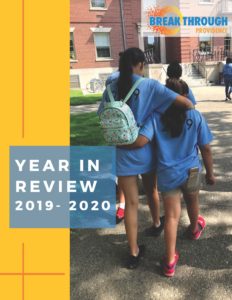 Cover for Breakthrough Providence Year In Review shows two students walking across a campus with their arms around each other.
