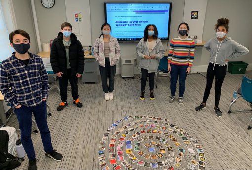 students in a semi-circle in their classroom