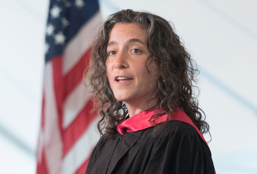 Woman speaking at a podium