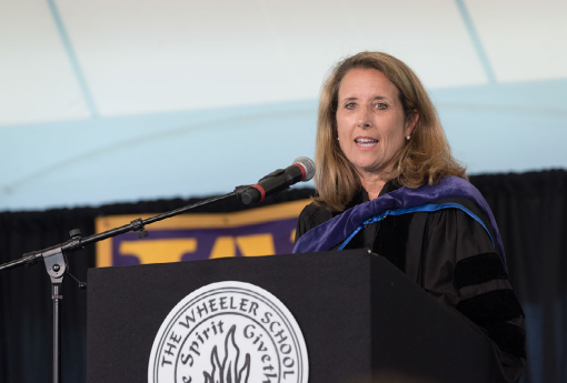 woman speaking at podium