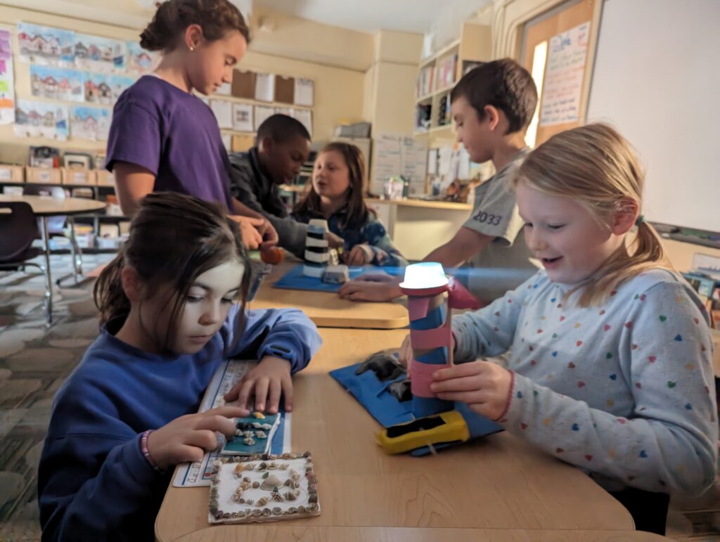 Third-graders creating model lighthouses, complete with working circuits and lights in Wheeler's DIB Lab.
