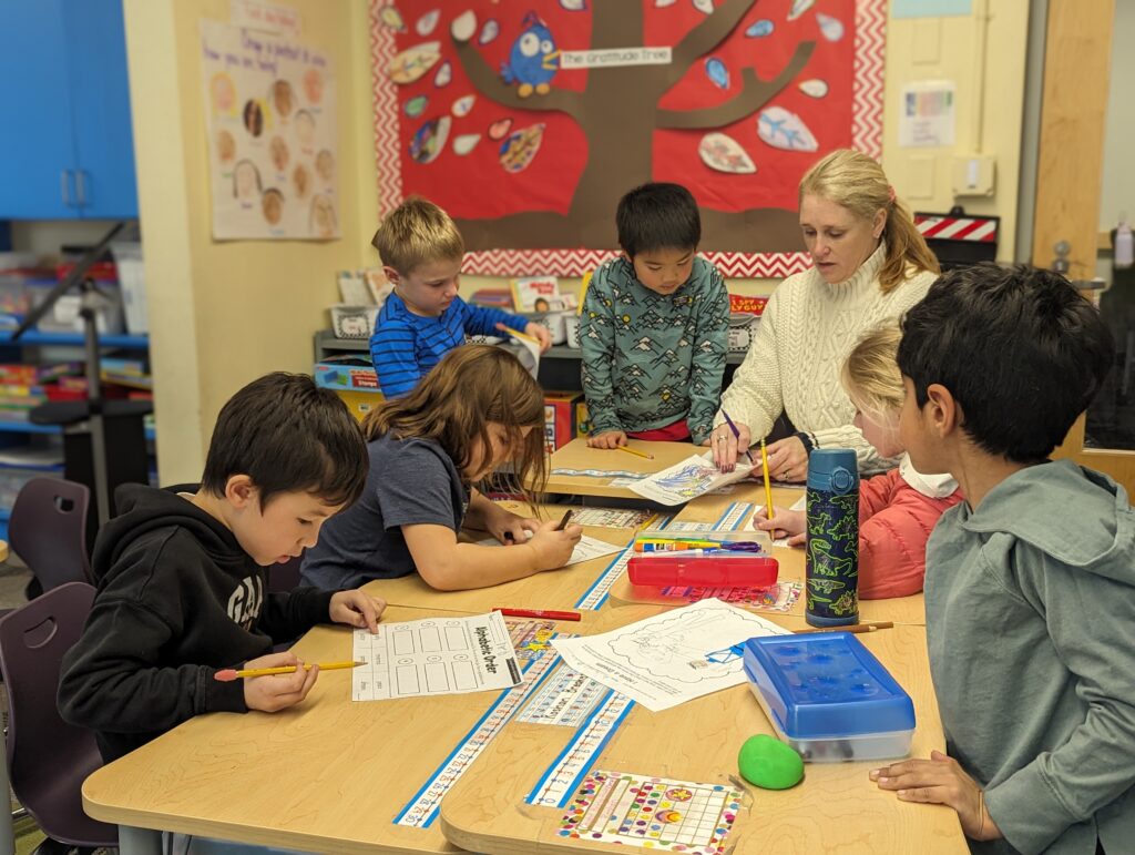 First-graders writing and illustrating their vision of a peaceful world.