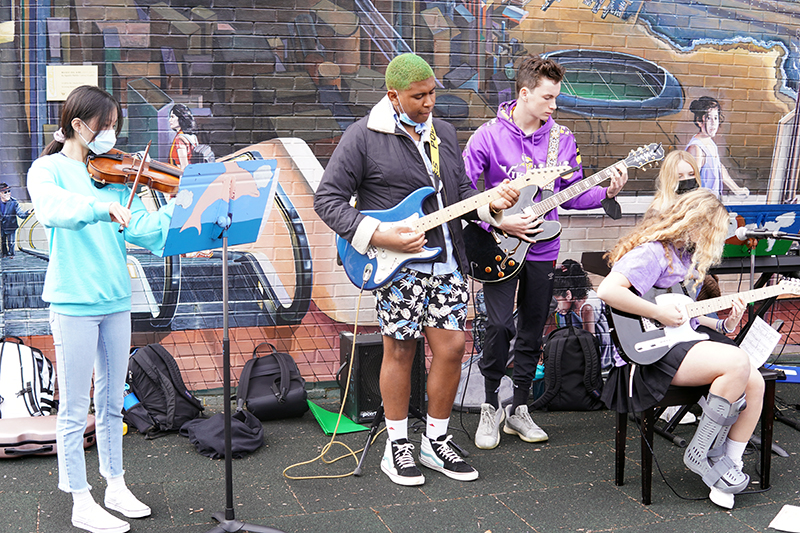 Upper School students playing jazz on the playground.