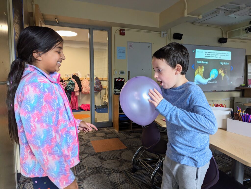 Fourth-graders exploring sound waves and the science of sound.