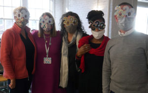 Head of School Allison Gaines Pell stands with colleagues from the College Counseling team. Everyone is wearing 2022 glasses.