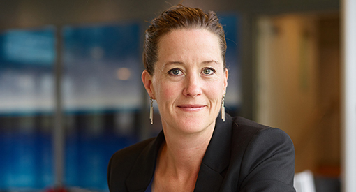 A photo of Middle School Director Vanessa O'Driscoll smiling at the camera while inside a building on the Wheeler campus.