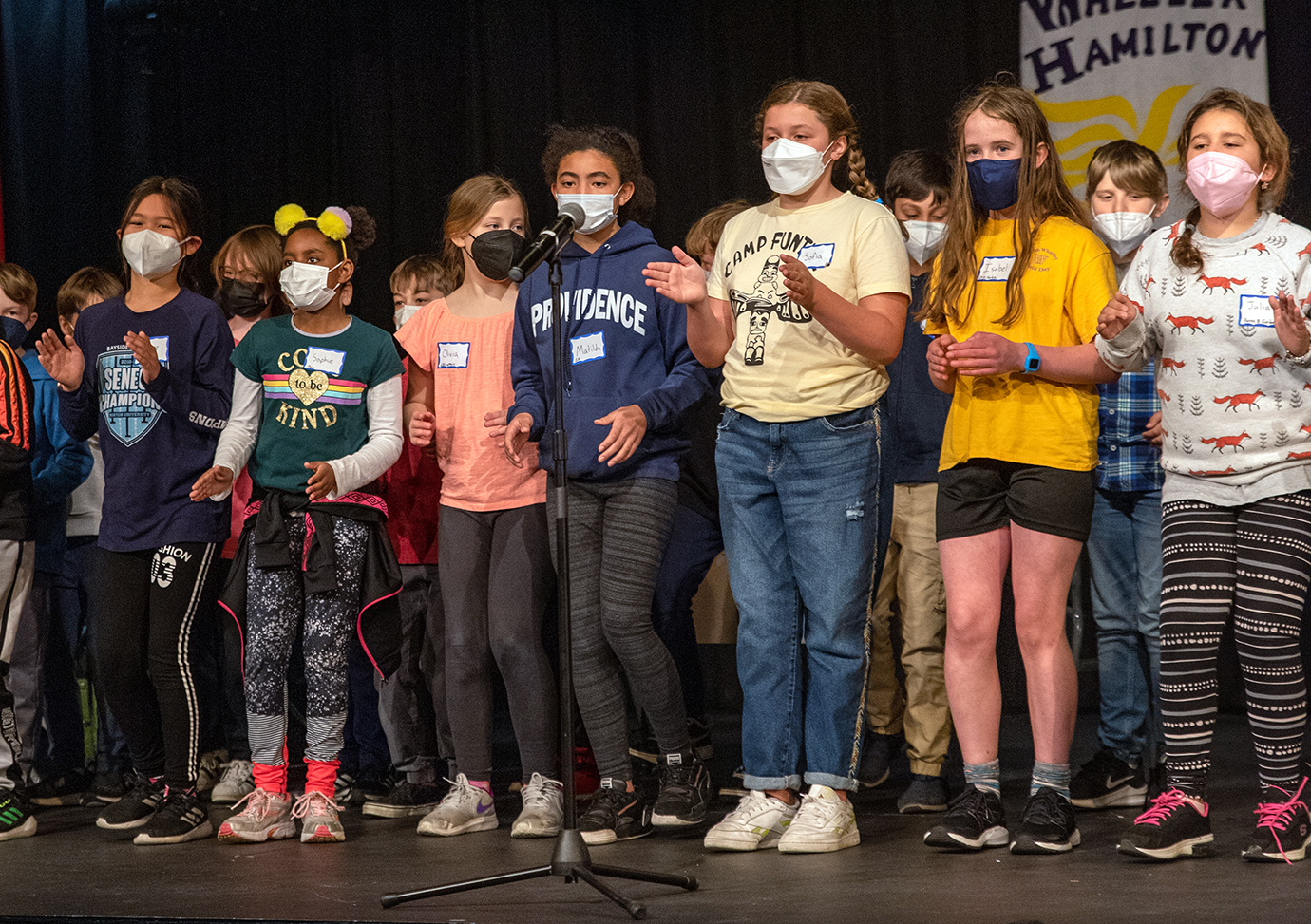 Wheeler students perform their cheer on stage at the 2022 Battle of the Books.