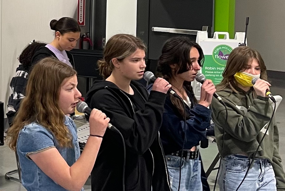 Students practicing their vocals during rehearsal.