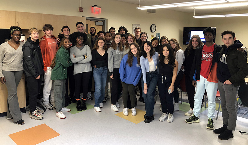 The 2022-23 Upper School Peer Supporters and their Advisors pose for a group photo in a Wheeler classroom.