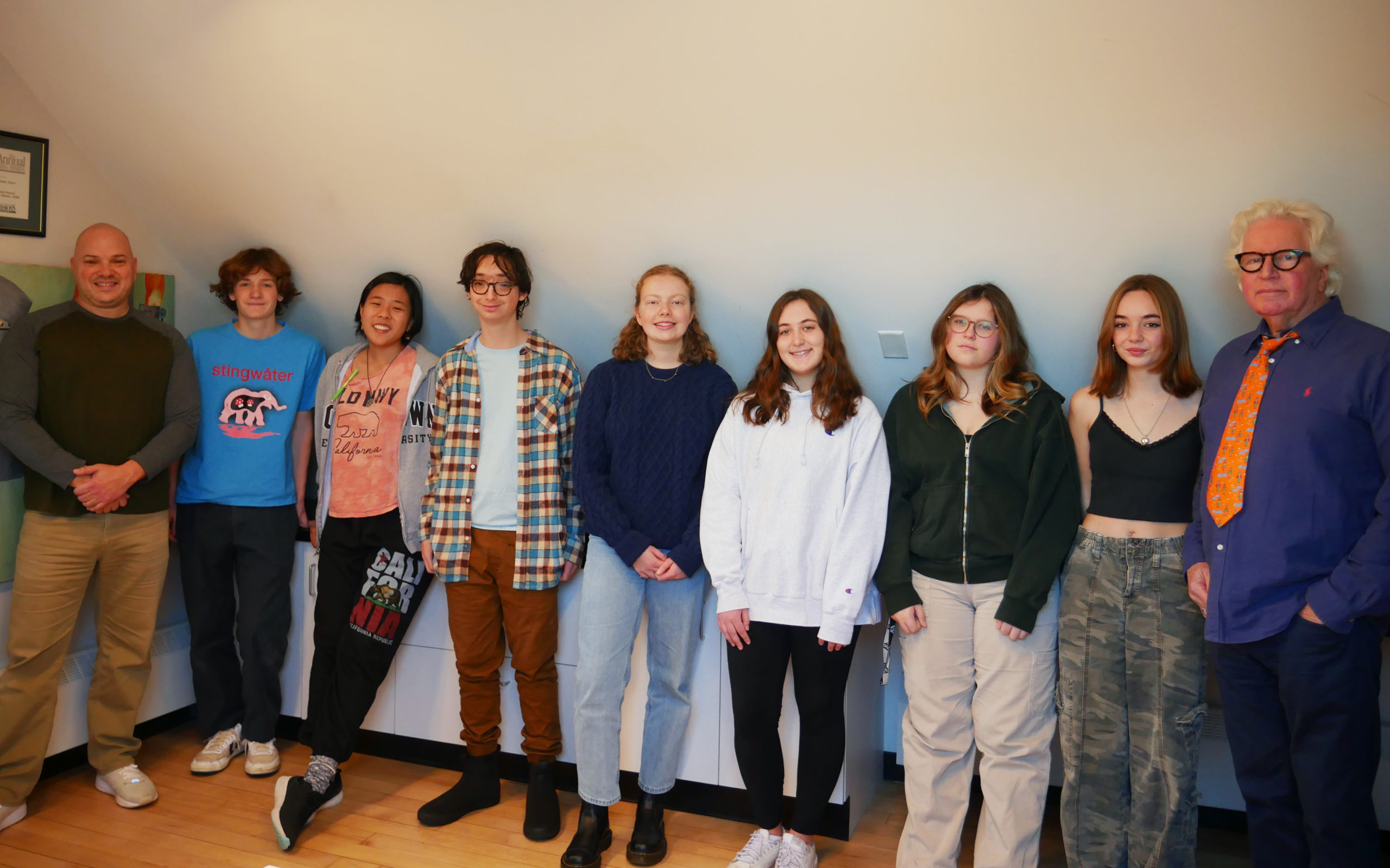 A group photo of Aerie Literary Voices students, WELH Radio Director of Operations David Schiano (far left) and Faculty Teacher Robert Koppel (far right).