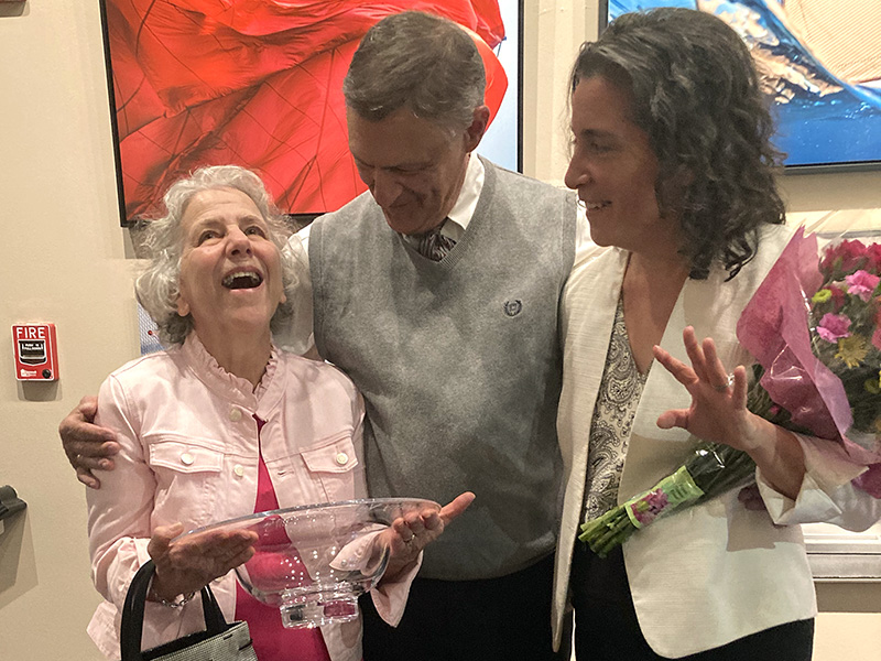 Dorothy holds the Trustees Award while standing next to her husband and Head of School Allison Gaines Pell.