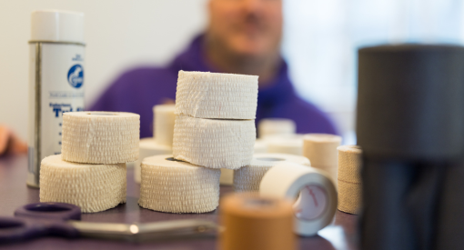 A pile of medical bandages on top of a medical professional's desk.