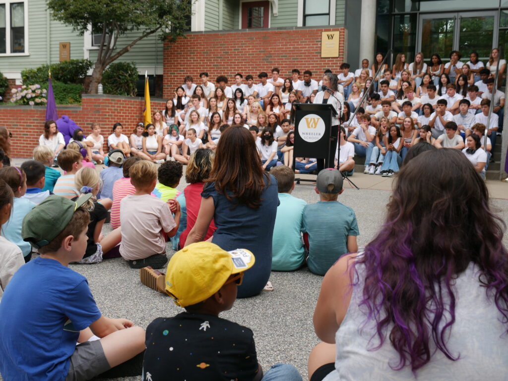 Allison Gaines Pell delivering the Opening Assembly speech.