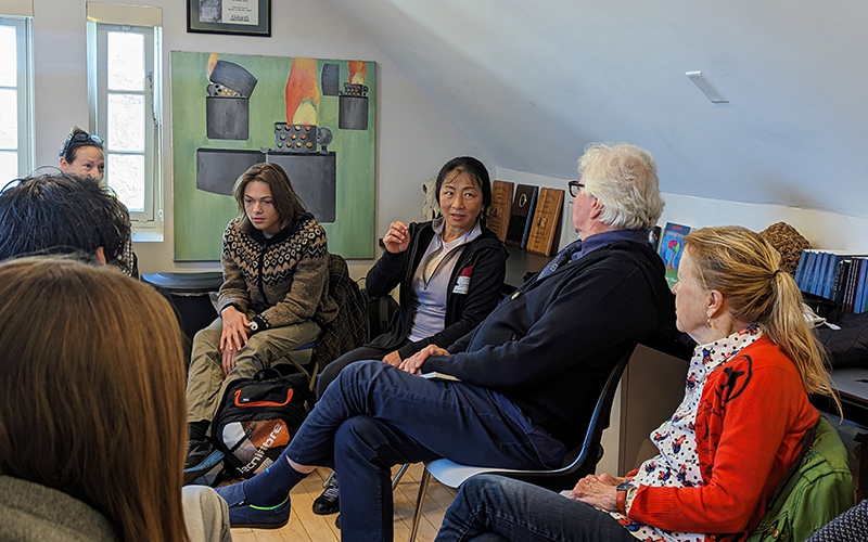 Photo of Wang Ping sharing her insights on writing and poetry and personal anecdotes. 