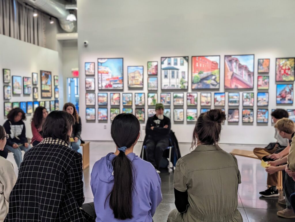 Eighth-graders in the Cityside program engaging with visual and performance artist Umberto "Bert" Crenca.