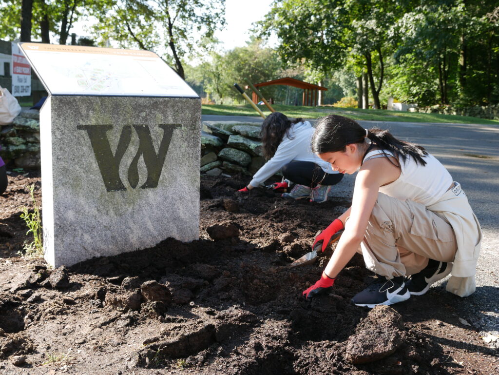 Students working on service projects at the farm campus.