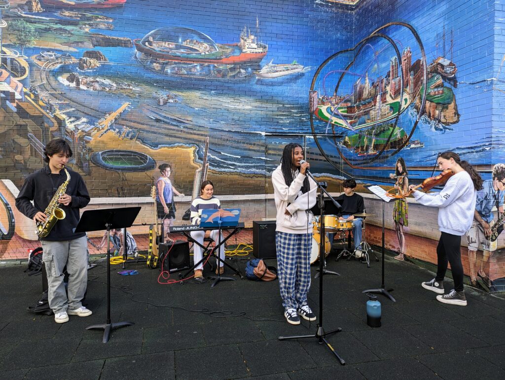 Advanced Ensemble class took their rehearsal session out of the music studio and onto the playground.