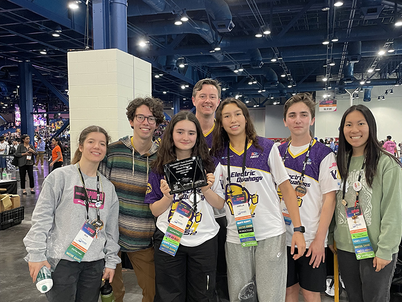 Group photo of a few members of Wheeler's Robotics Team 252 after being awarded second place for the Connect Award for their outstanding work collaborating with STEM professionals this season.