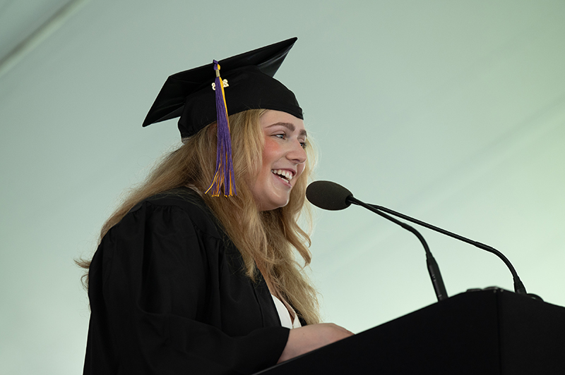 Lila Stone '26 speaks at the podium at Wheeler's 137th Commencement.